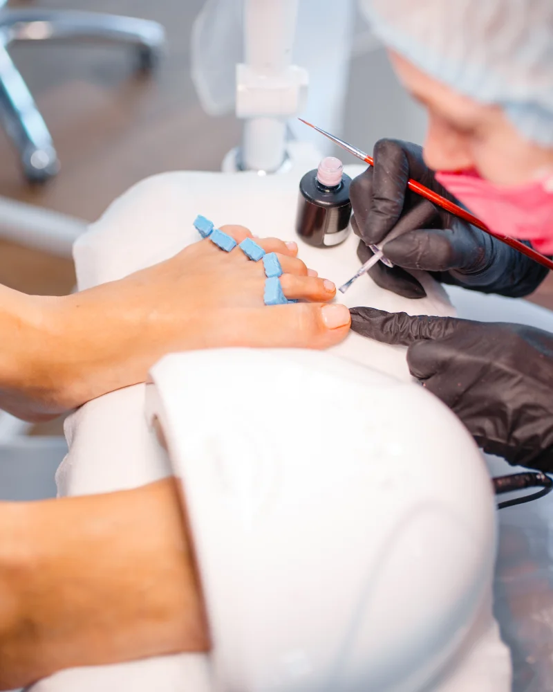 cosmetologist-salon-pedicure-varnish-application-2024-11-26-20-14-21-utc